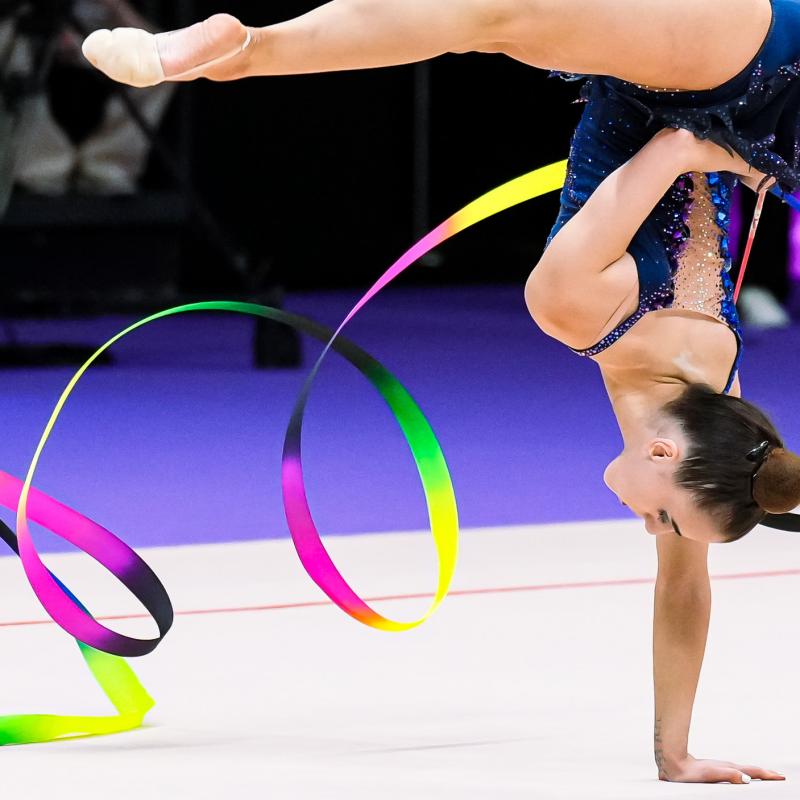 Gymnast competing with ribbon